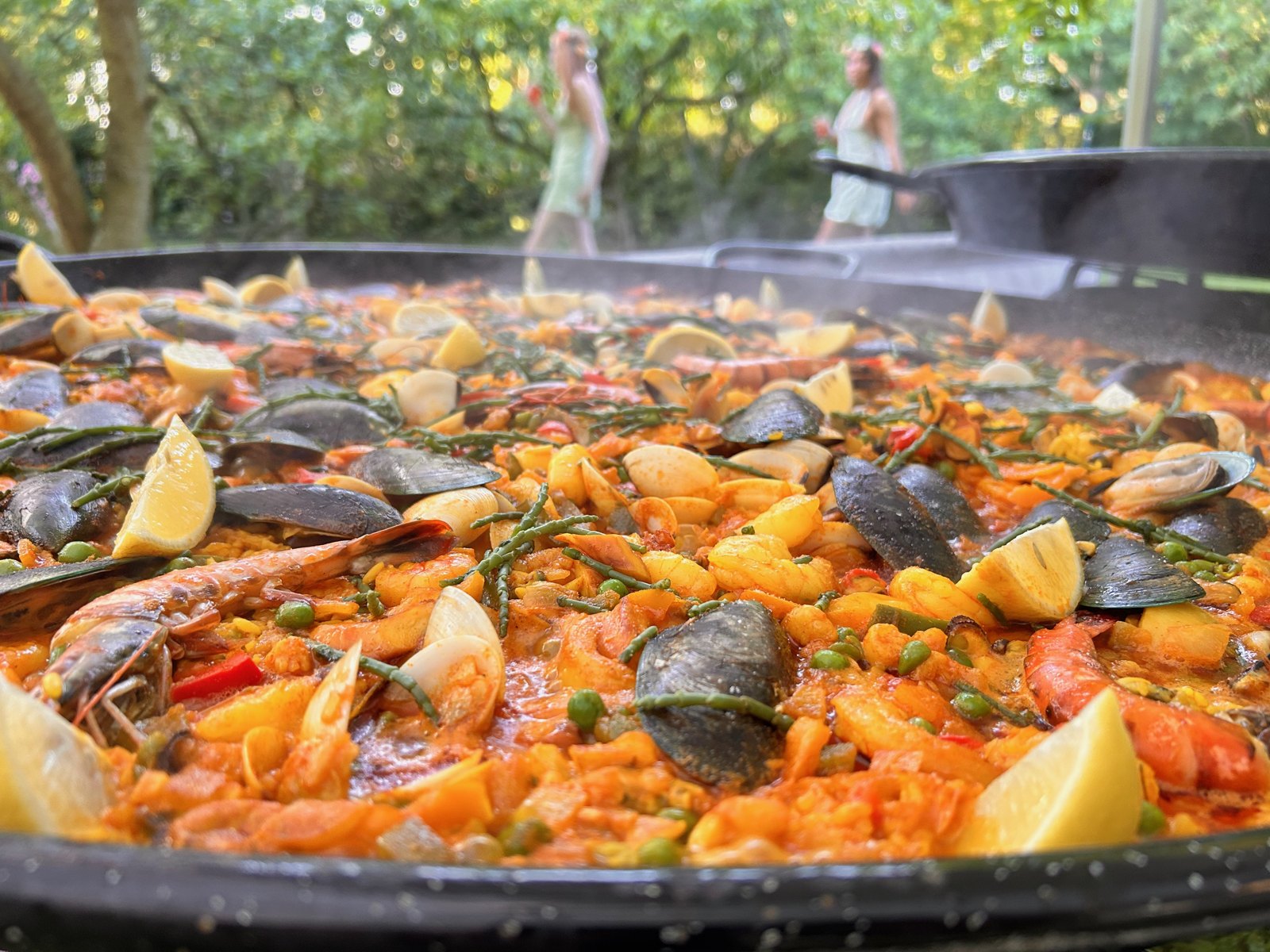 Steam rising from a freshly cooked paella