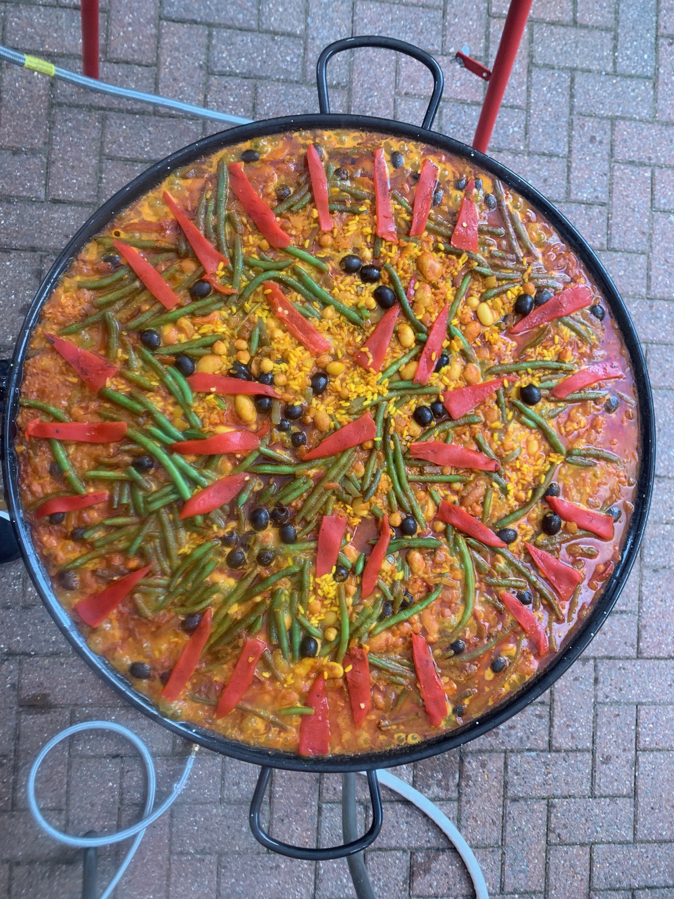 Vegan vegetable paella with peppers in a large pan
